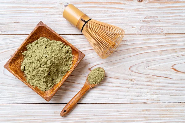 matcha green tea powder with whisk