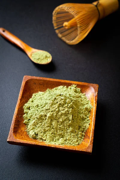 matcha green tea powder with whisk