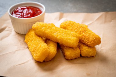 crispy fried fish fingers with ketchup clipart