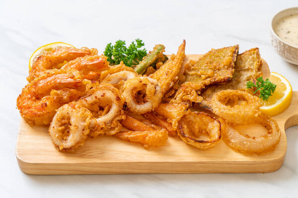 deep fried seafood (shrimps and squid) with mix vegetable - unhealthy food style