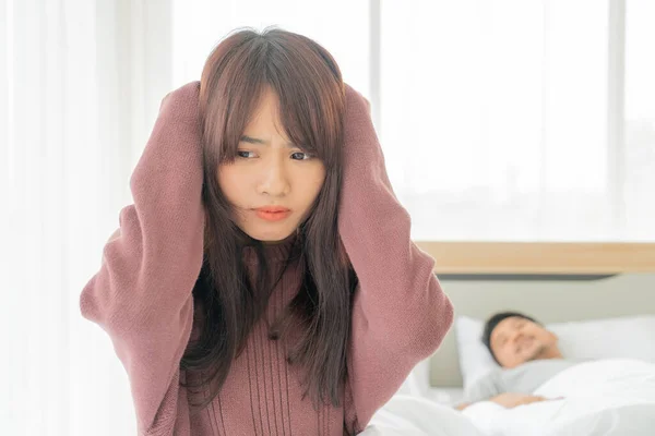 The Asian wife have problems with snoring husband