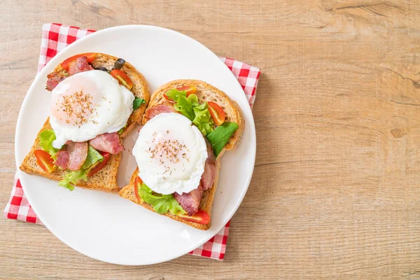 whole wheat bread toasted with vegetable, bacon and egg or egg benedict for breakfast
