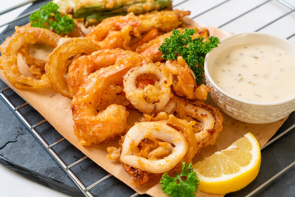 deep fried seafood (shrimps and squid) with mix vegetable - unhealthy food style