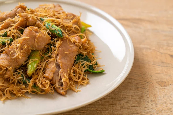 Stir fried rice vermicelli noodle with black soy sauce and pork - Asian food style