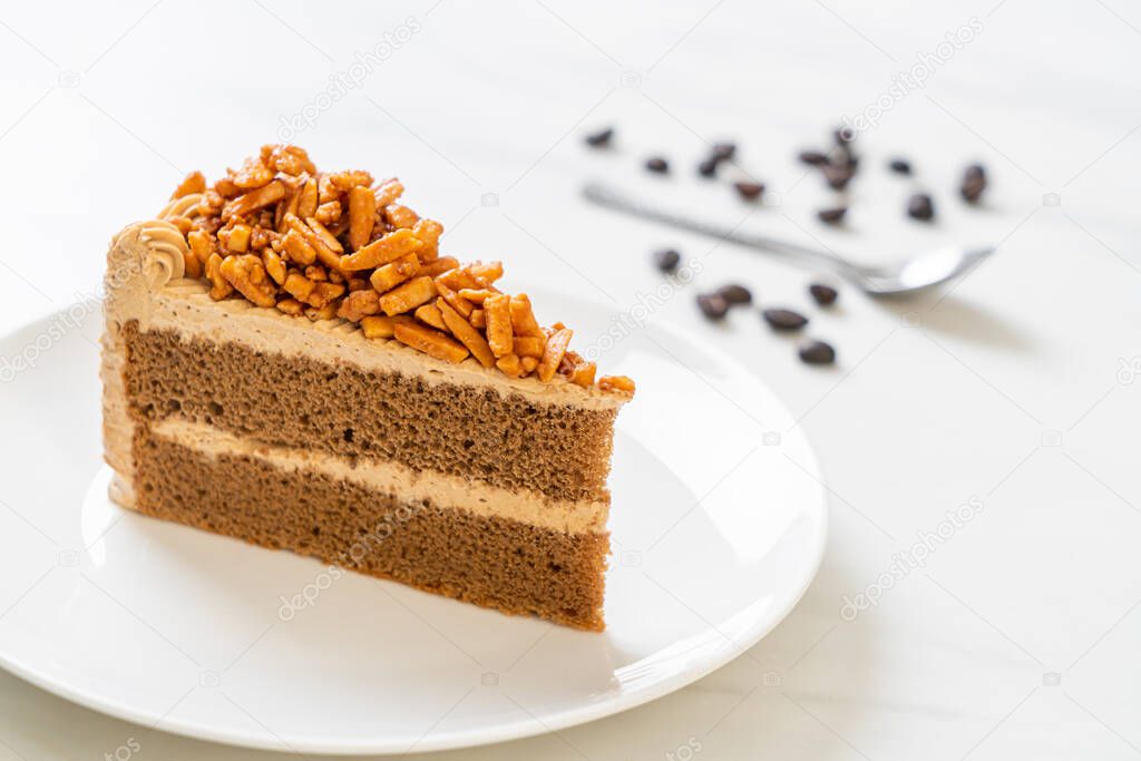 homemade coffee almonds cake on white plate