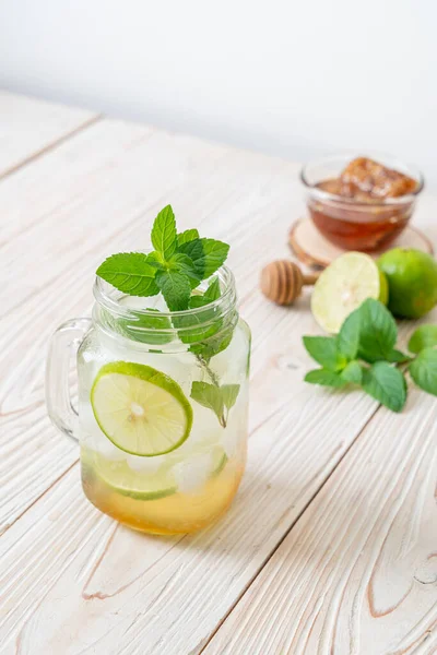 iced honey and lime soda with mint - refreshing drink