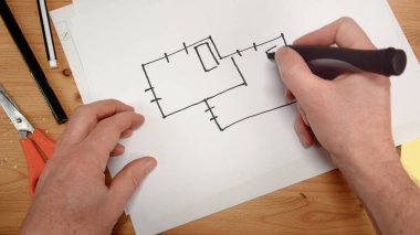 Üstten Görünüm, bir iç mimar el yeni bir ev, görüntüleri bina yenileme, tasarım, yeni ev ve aile gibi konular için ideal için ideal bir harita çizer.