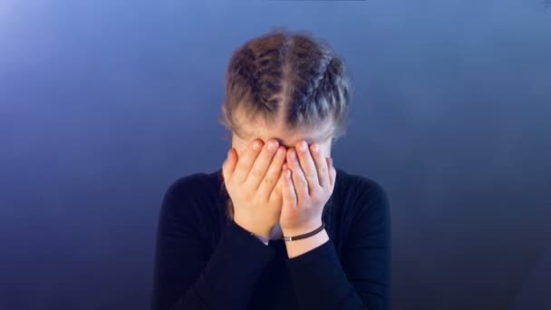 Teenage girl with pigtails, being attacked by social media, creating emotional stress — Stock Video