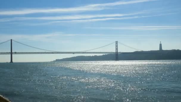 25 de Abril bridge in Lisbon, Portugal. A suspension bridge twin of the Golden Gate bridge — Stock Video