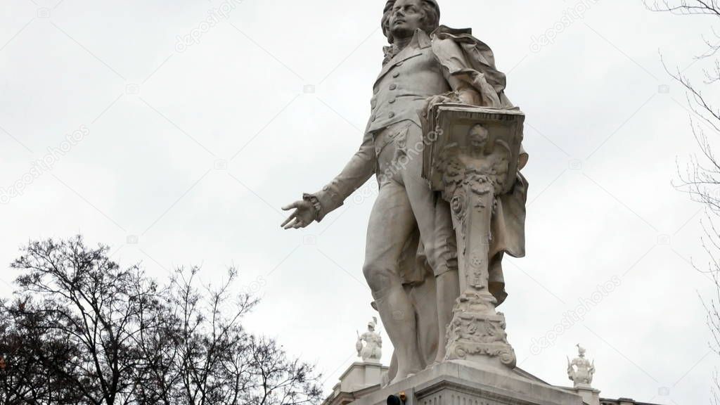 Mozart Statue in Vienna, Austria. Wolfgang Amadeus Mozart is definitely one of the best known names connected with Vienna and Austria. Mozarts statue in Vienna city center. Imperial Palace Gardens