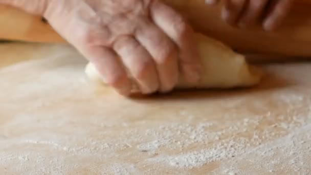 Close up on pasta that is rolled out with a rolling pin — Stock Video