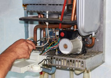 Repair of a gas boiler, setting up and servicing by a service department. clipart