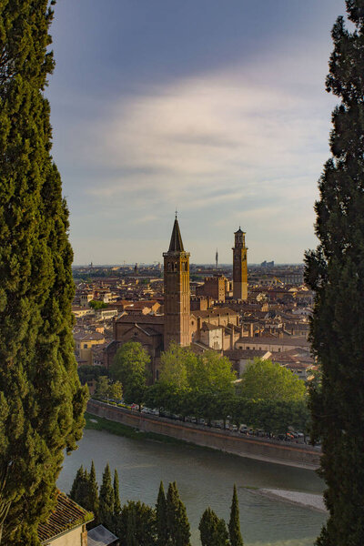 Verona Skyline with Adige River, Basilica of Santa Anastasia and Lamberti Tower, Italy. View from above.
