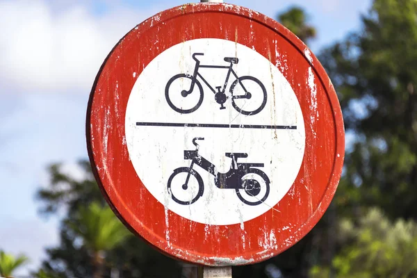 Outdoor road sign indicating forbidden traffic for bicycles, bikes and motorbikes on the jemaa el fna square in Marrakech, Morocco