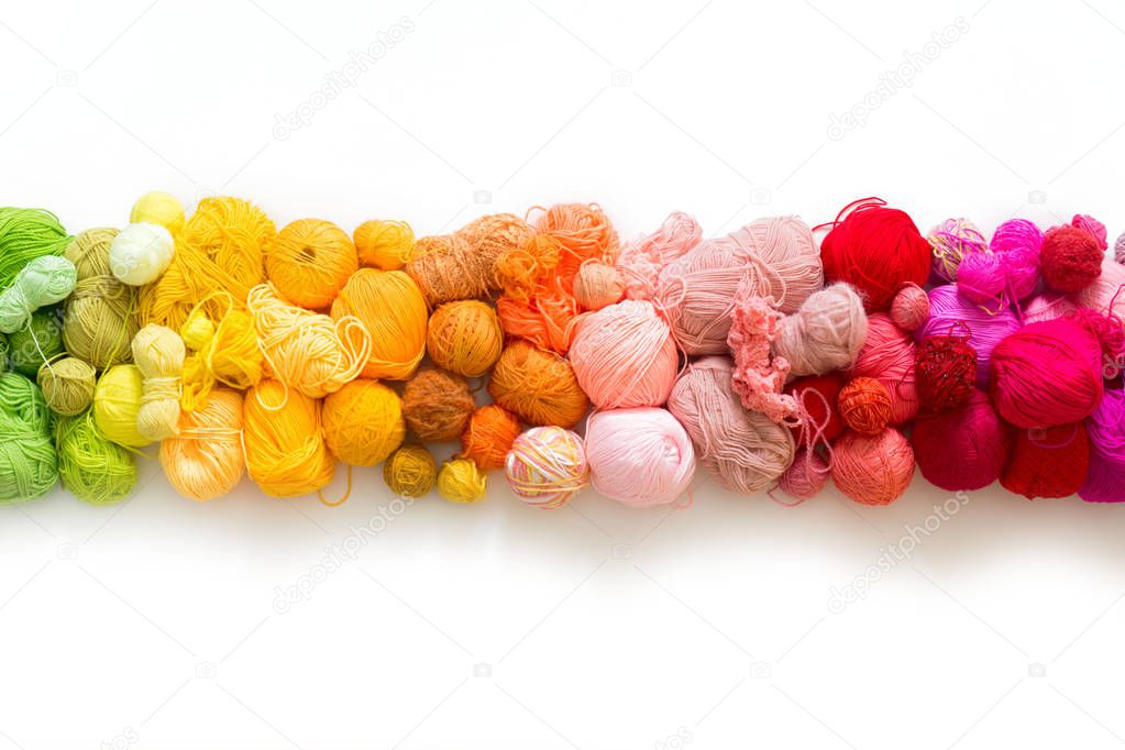 Colored balls of yarn. Knitting needles. Crocheting yarn