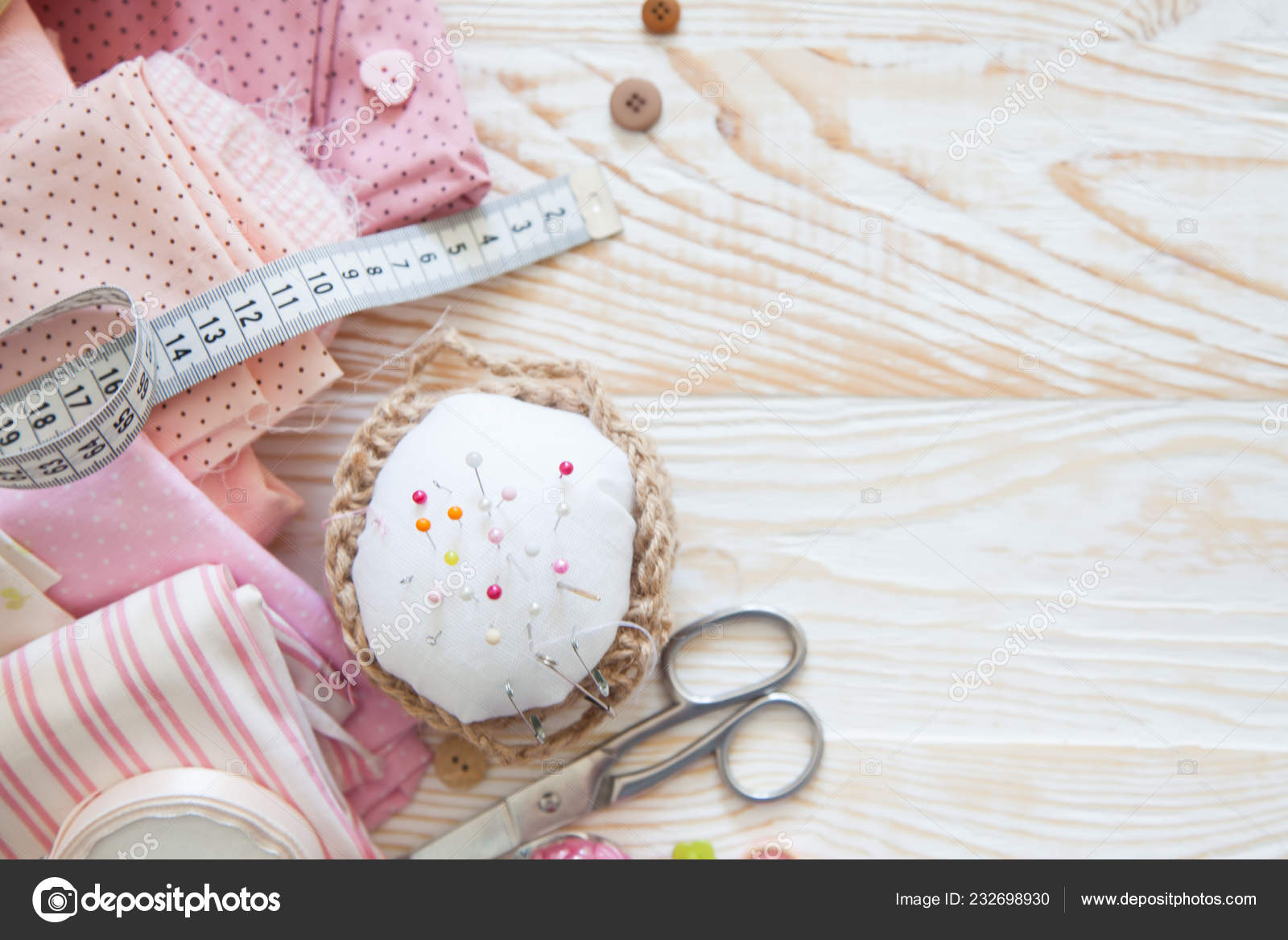 Creative sewing supplies and accessories on a table Stock Photo by