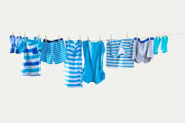 Clothesline Hanging Baby Clothes Yellow Background — Stock Photo, Image