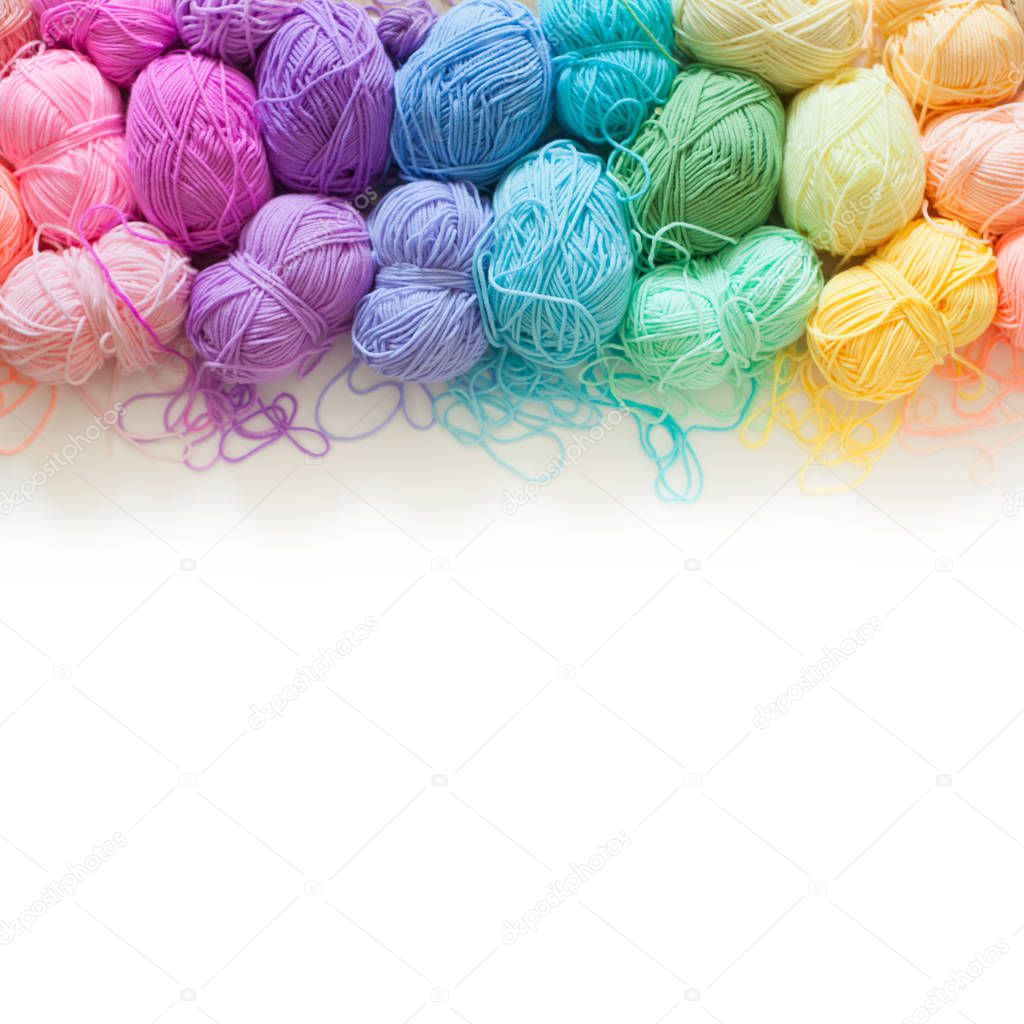 Color yarn for knitting, knitting needles and crochet hooks. yellow background. 