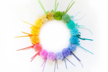 Garland and a wreath of colored pompons. Bright yarn pastel colors. clipart