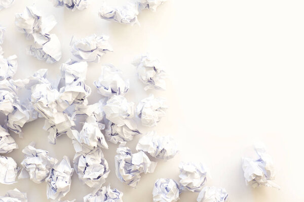 Pile of crumpled paper on a white background.