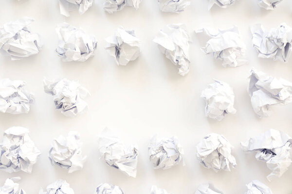 Pile of crumpled paper on a white background.