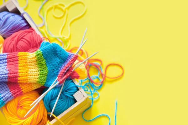 Colored balls of yarn. Rainbow colors. All colors. Yarn for knitting. Skeins of yarn.