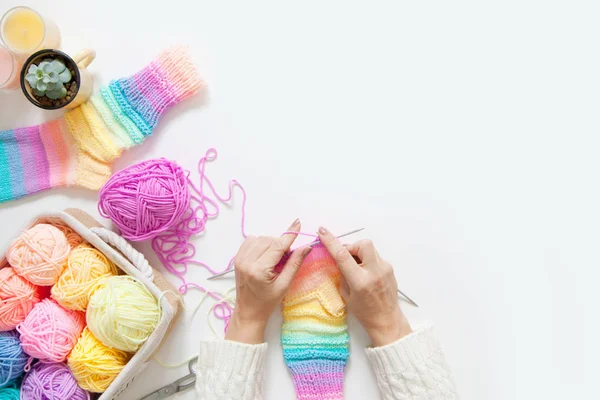 Colored balls of yarn. View from above. Rainbow colors. All colors. Yarn for knitting. Skeins of yarn.