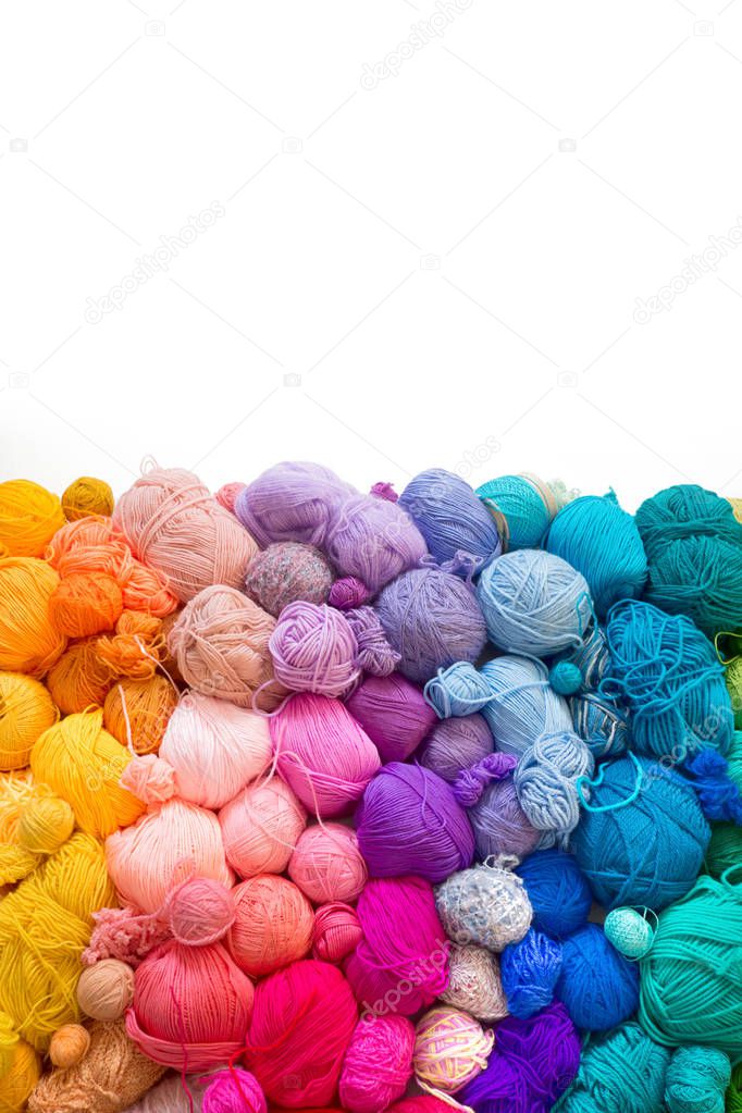 Colored balls of yarn. Knitting needles. Crocheting yarn
