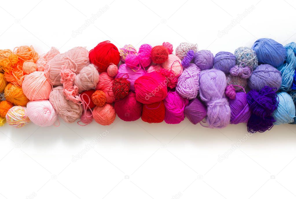 Colored balls of yarn. Knitting needles. Crocheting yarn
