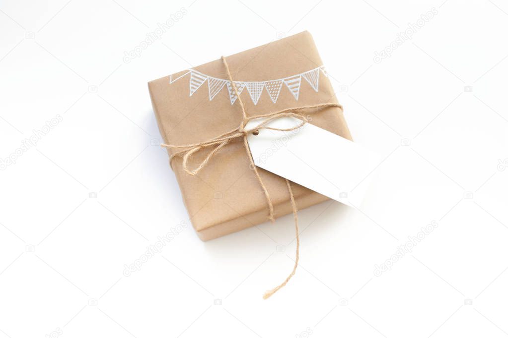 White gift box. Drawing of a white garland, flags. White backgro