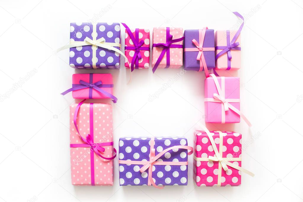 Colored gift boxes with colorful ribbons. white background. Gifts for St. Valentine's Day or a birthday.