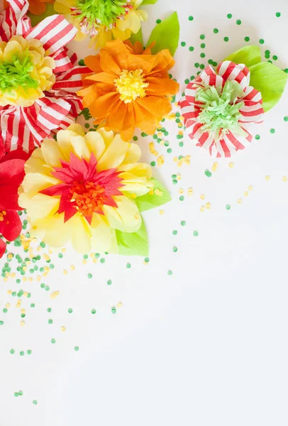 handmade paper flowers on background