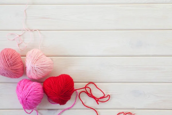 warm hearts made of red and pink wool yarn