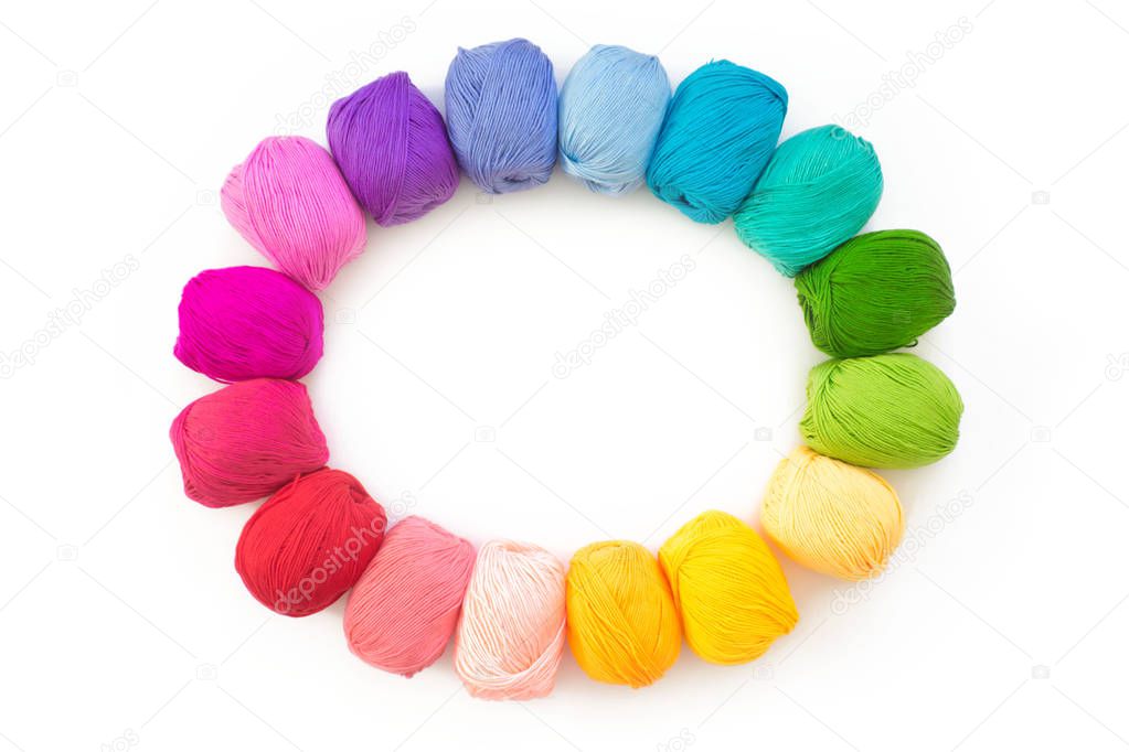 Colorful rainbow yarn for knitting. Hooks, scissors and knitting needles.