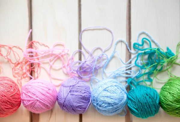 Many colorful yarn for handmade knitting in a needlework shop. Stock Photo  by Glebcallfives