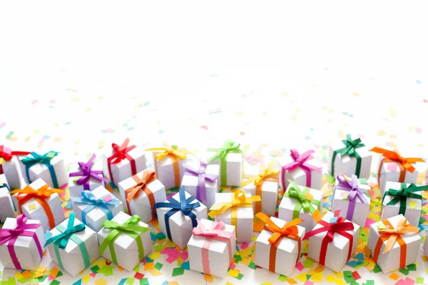 Colored gift boxes with colorful ribbons. White background. Gifts for Christmas or a birthday.