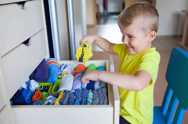 Child Puts His Clothes Boy Pulls Shirt Out Closet — Stock Photo, Image