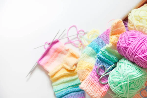 Colored balls of yarn. View from above. Rainbow colors. All colors. Yarn for knitting. Skeins of yarn.