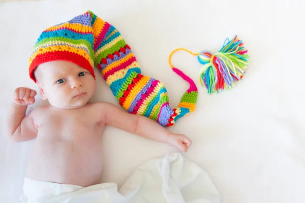 Baby One Month Lying White Background Rainbow Cap Gnome — Stock Photo, Image