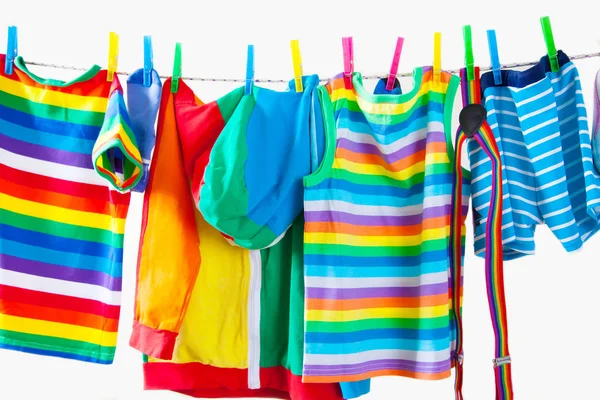 Clothesline Hanging Baby Clothes Yellow Background — Stock Photo, Image