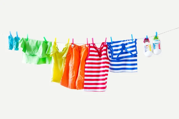 Clothesline Hanging Baby Clothes Yellow Background — Stock Photo, Image