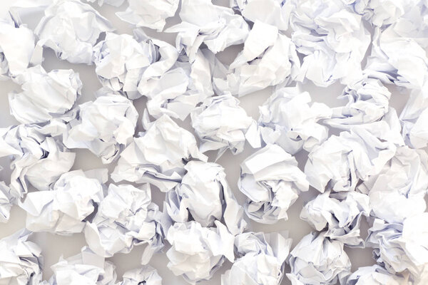 Crumpled sheets of white paper ball. A lot of trash paper. White