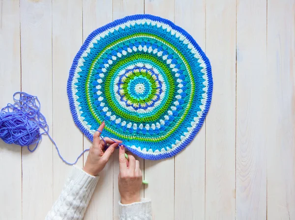 Female hands knitting with color wool, top view. Mandala crochet — Stock Photo, Image