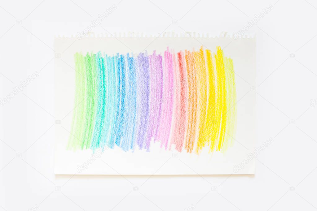 Colorful bright pencils for drawing pictures and sketches. On white and yellow background. top view