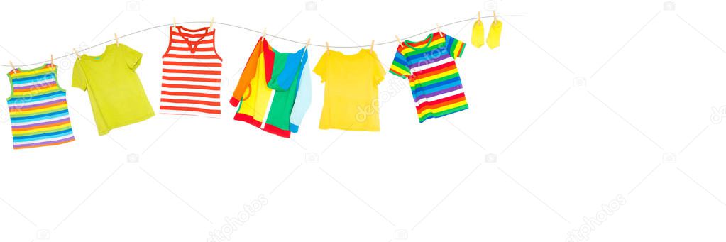 Washing of children's, bright clothes. Laundry room.