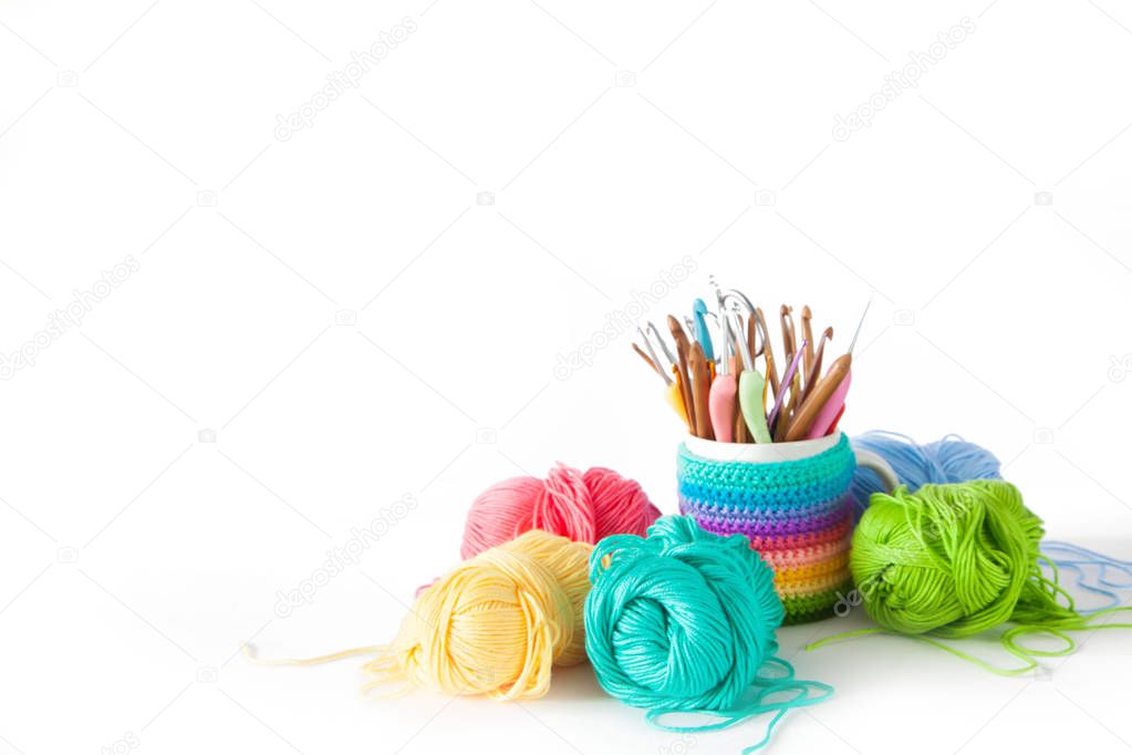 Colored cotton yarn for knitting in a basket. Isolate.