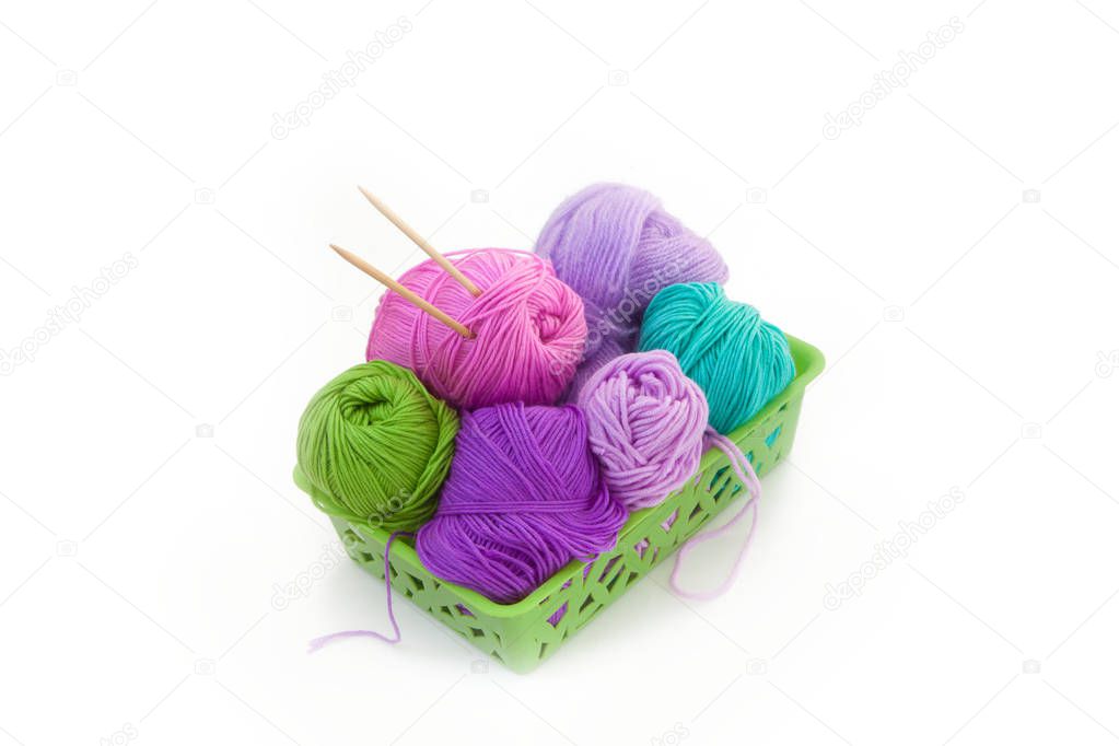 Color yarn for knitting in the basket. Knitting needles. Isolate