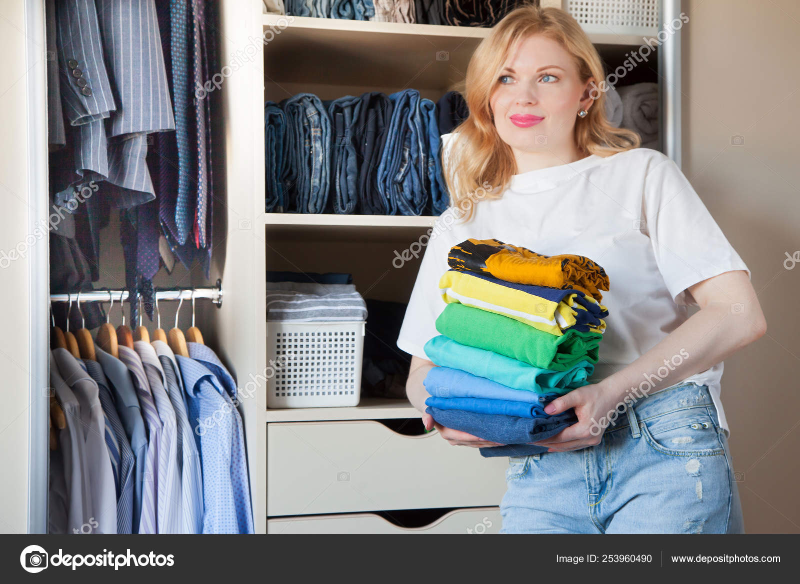 Woman Folds Clothes Vertically On A Wardrobe Shelf Japanese Sto