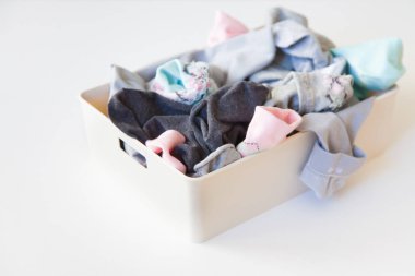 Pile of unsorted dirty socks. Messed up socks. White background. clipart
