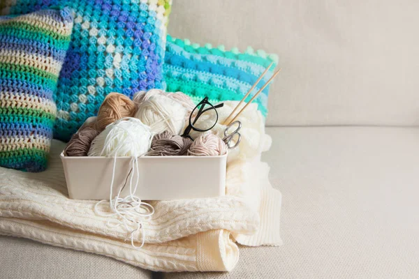 Yarn in a basket of beige and neutral, natural tones, knitting a — Stock Photo, Image